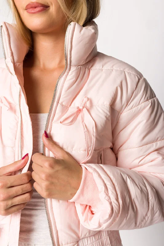 Bold fashion choices for the confident woman   Eloise Ribbon Bow Puffer Jacket in Pink